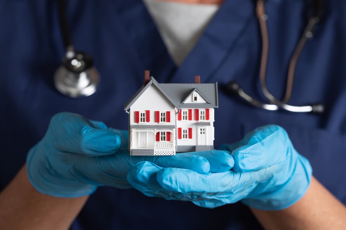 Doctor checking patient at home